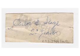 Etiqueta con inscripción “Carlos E. Alaye, 2do grado”